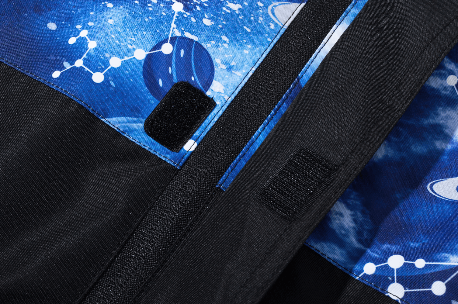 Close-up of Kids' Outer Space Waterproof Zip Hooded Jacket - SF3585 featuring galaxy print and fleece lining.