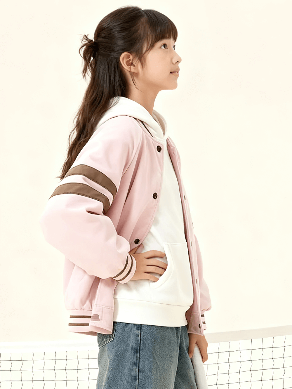 Side view of girl wearing Kids Padded Baseball Jacket with Snap Buttons - SF3866, featuring pink color and sporty design.