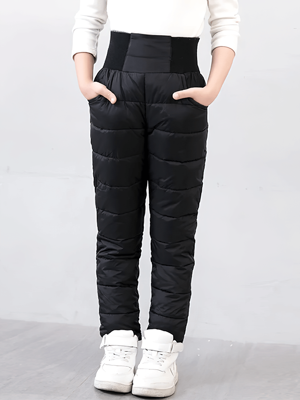 Child wearing black Kids Padded Pants with Elastic High Waist - SF3753, featuring thick insulation and high waist for cold weather protection.