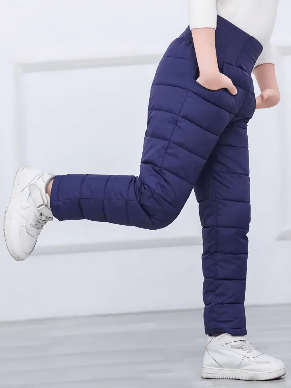 Child wearing Kids Padded Pants with Elastic High Waist - SF3753, navy, thick, waterproof, for cold weather outdoor play, side view.