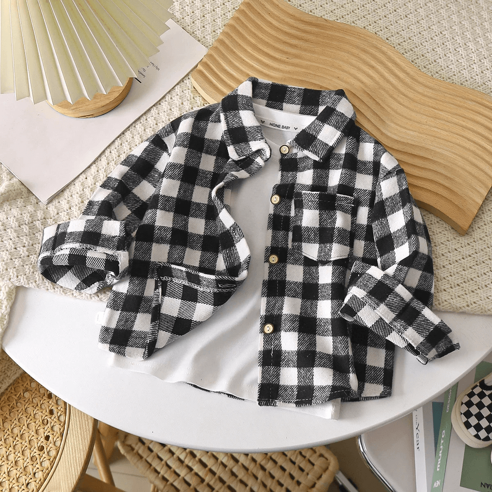 Kids Plaid Flannel Cotton Shirt with Buttons - SF3513 displayed on a chair with rollable cuffs and chest pocket.