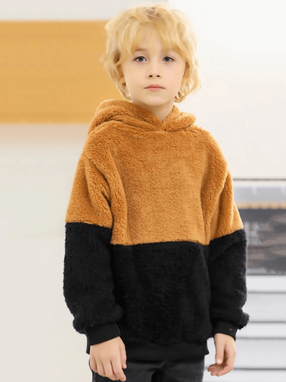 Child wearing a Kids Plush Hoodie with Cute Bear Ears Design - SF3896, color block fuzzy pullover, ideal for winter outings.