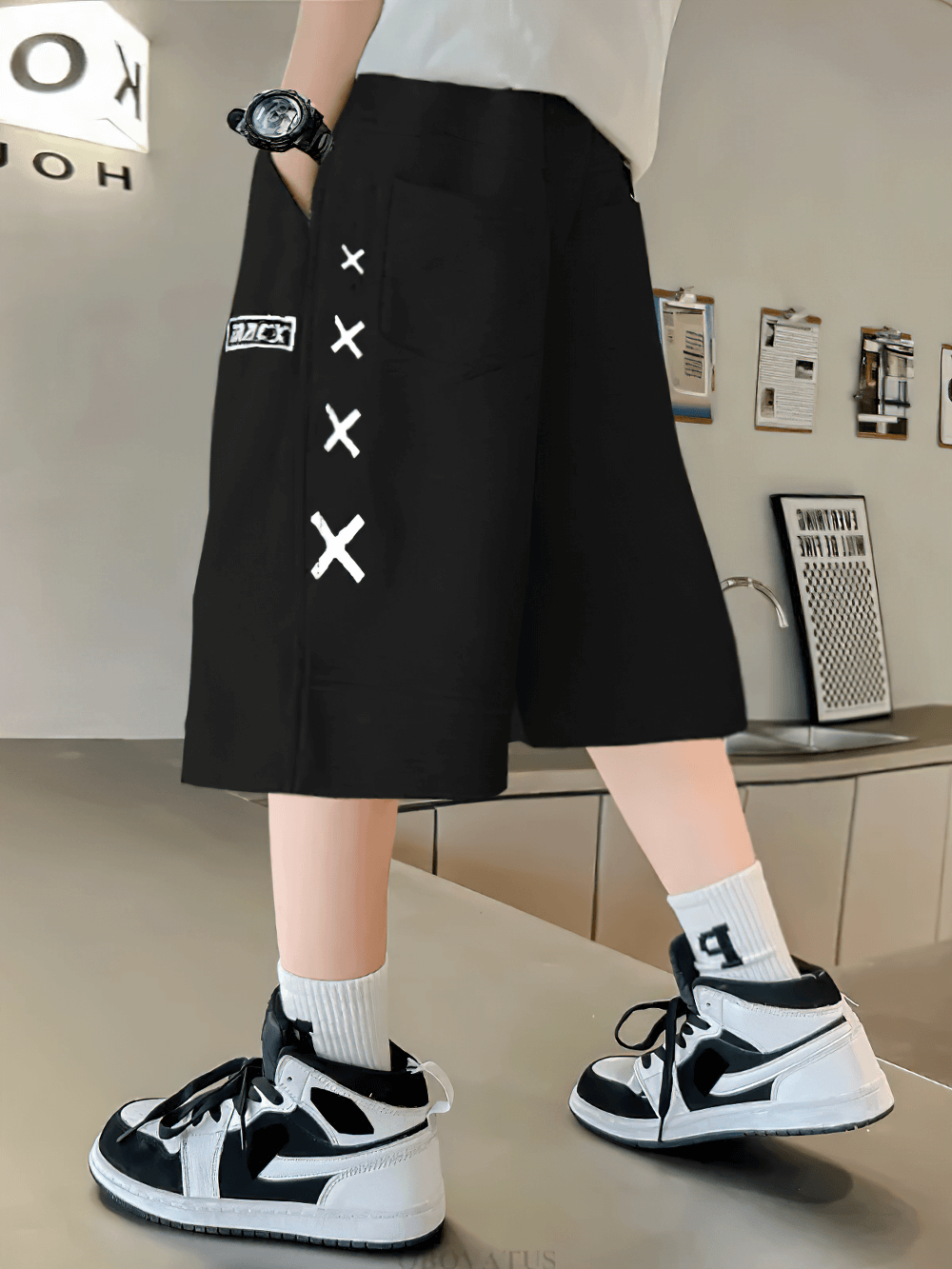 Youth wearing Kids Print Loose Fit Soft Shorts With Pockets - SF3878, featuring bold X graphics and side stripe design.