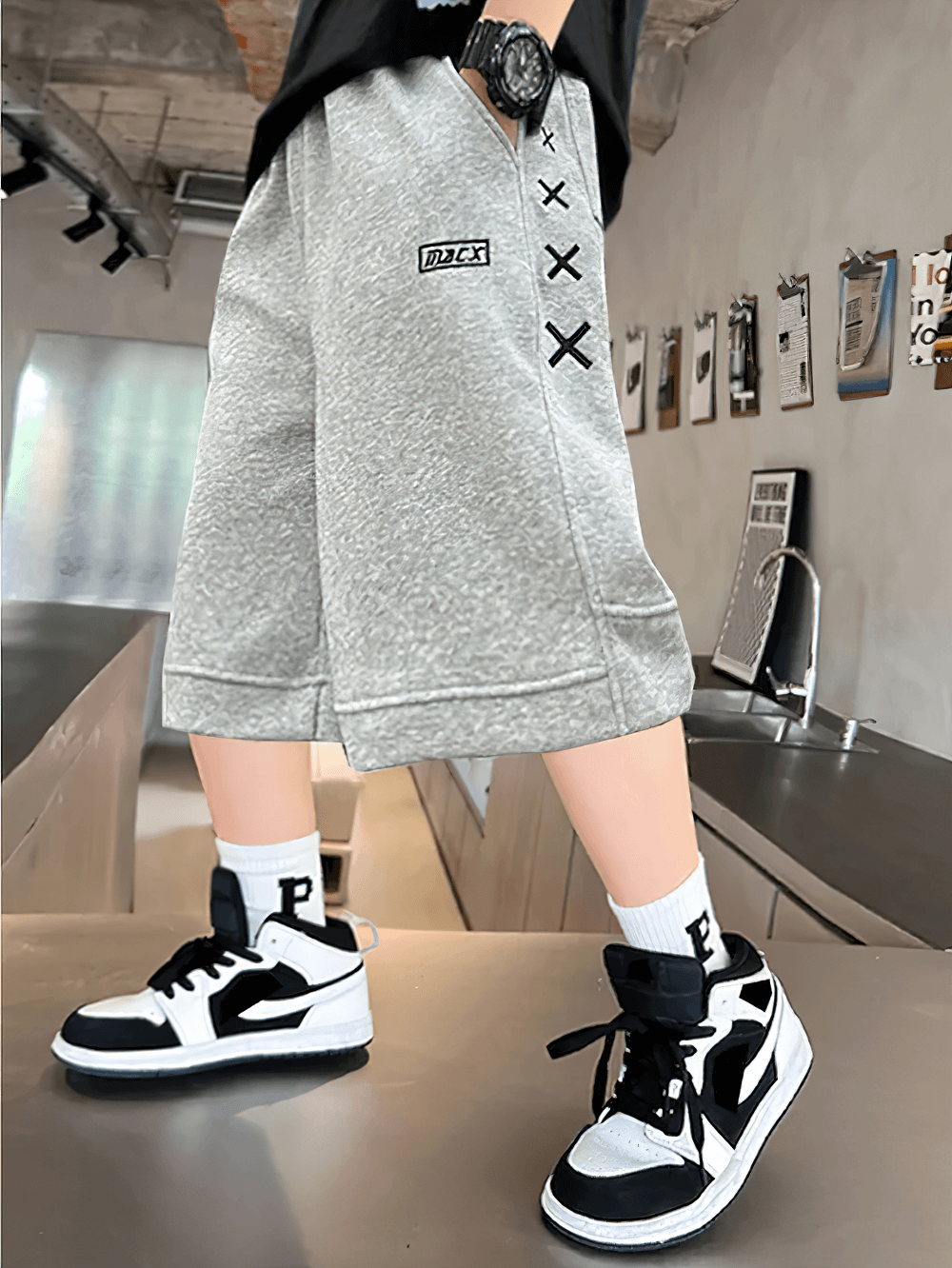 Stylish Kids Print Loose Fit Soft Shorts With Pockets - SF3878 featuring a bold X graphic and side stripe for trendy youth fashion.