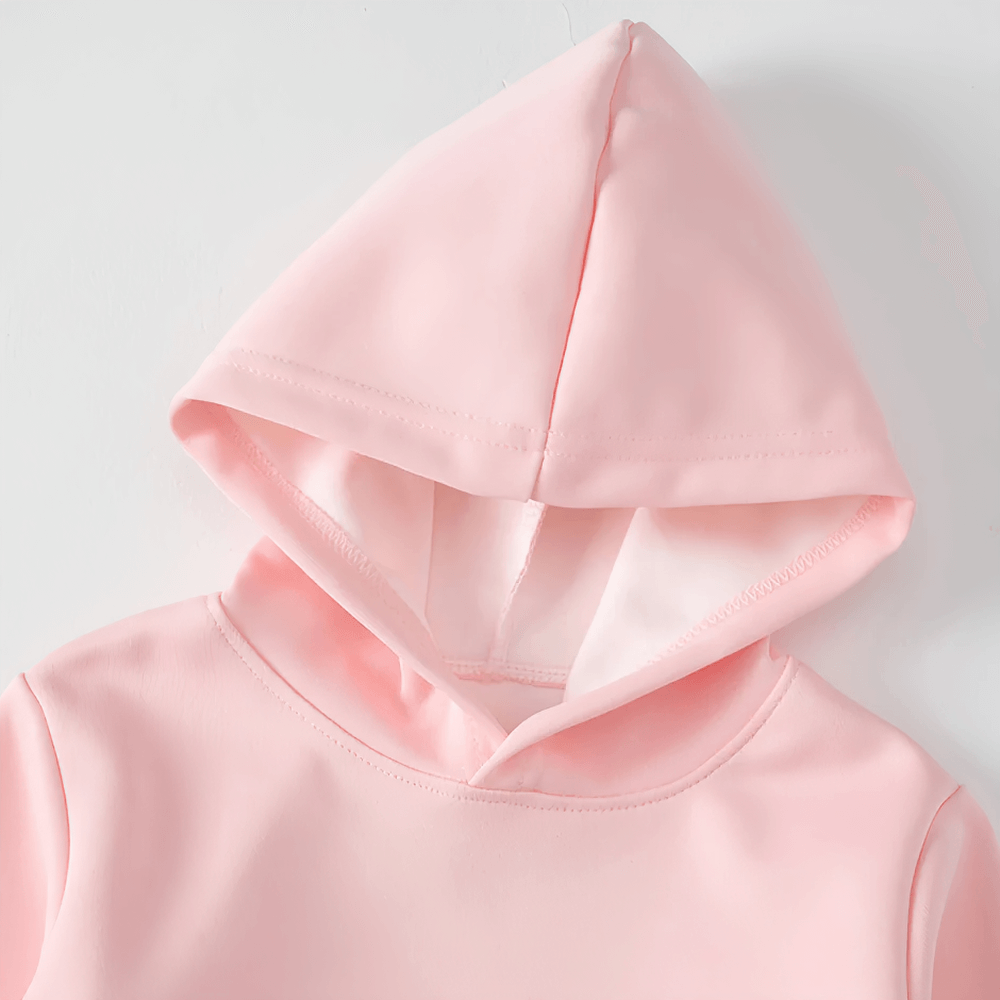 Pink kids pullover hoodie with front pocket and hood, perfect for casual wear and layering during play or school.