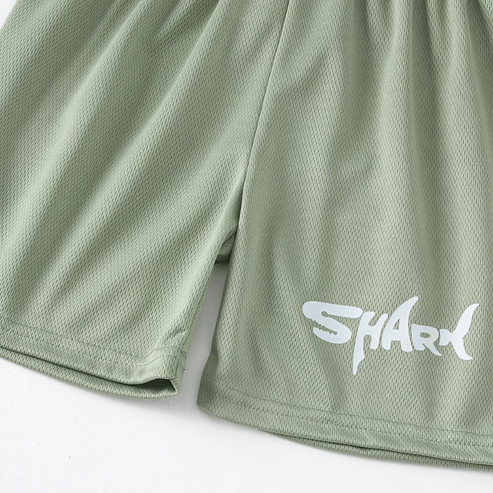 Green quick-drying kids' shorts with shark letter print, breathable fabric perfect for sports and play, part of 3-piece set.