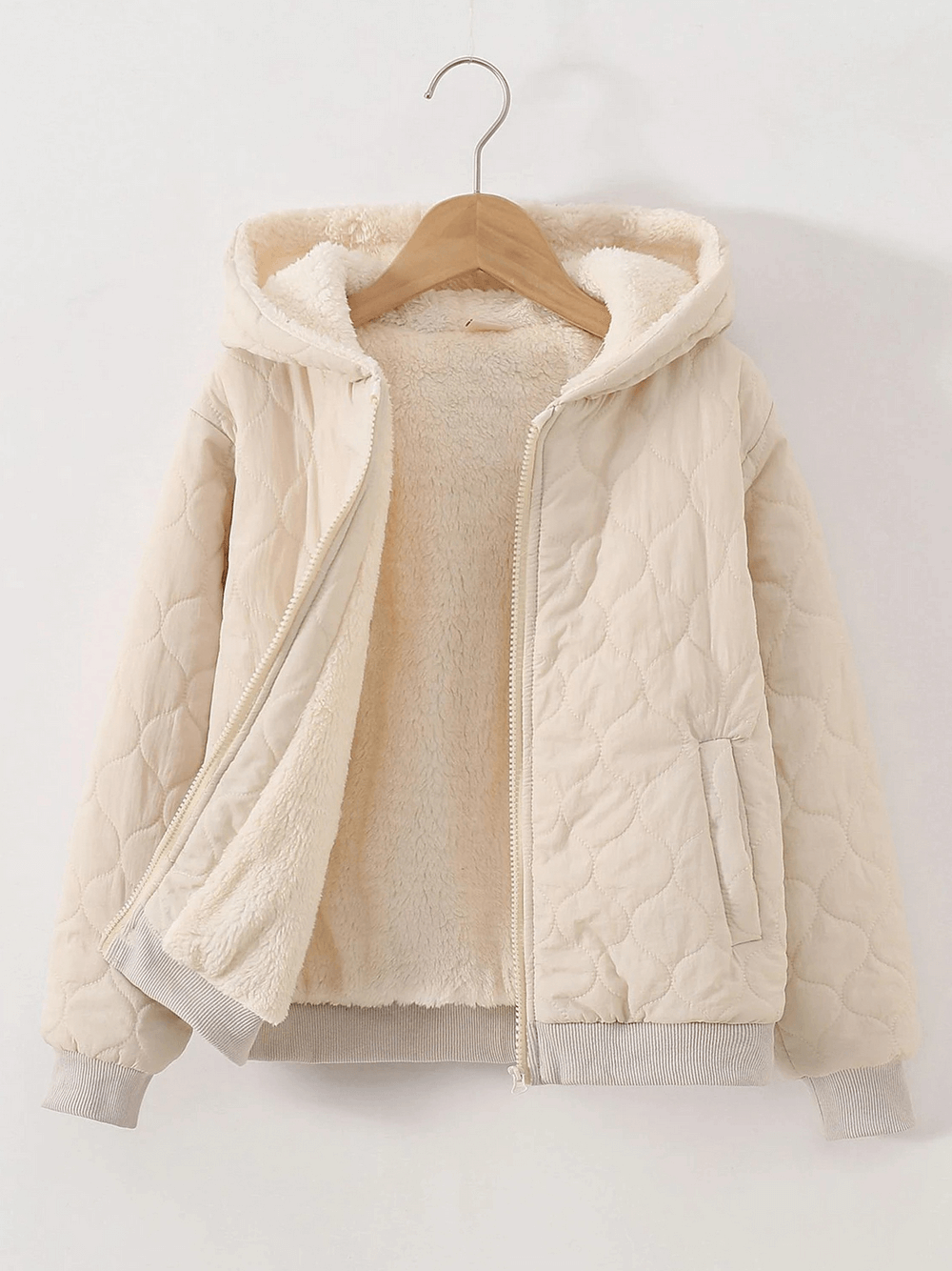 Kids Quilted Hooded Jacket with Warm Sherpa Lining - SF3898, beige, with zip front and ribbed cuffs, hanging on a hanger.
