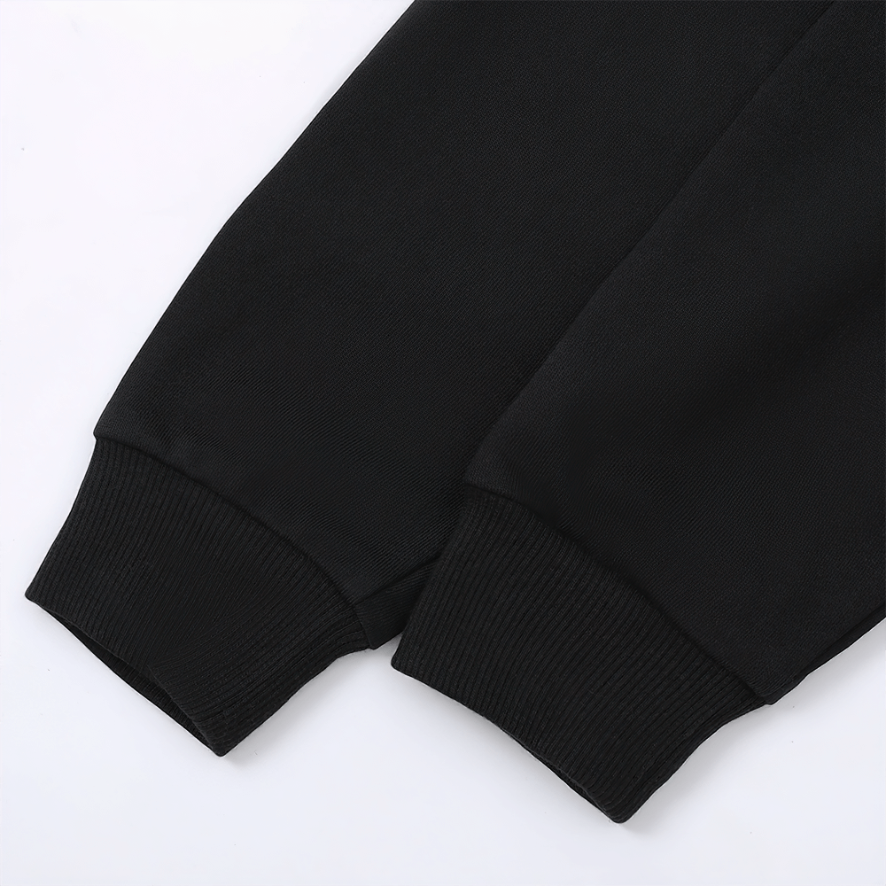Close-up of black kids' hoodie sleeve cuffs, showcasing quality stitching and soft fabric for school and casual wear. Unisex, available in multiple colors.