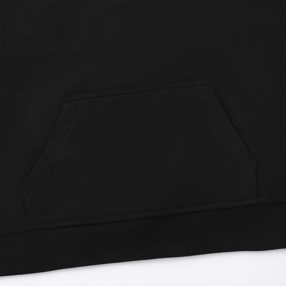 Close-up of a black kids' solid color hoodie showing the front pocket, ideal for boys and girls, perfect for school and casual wear.