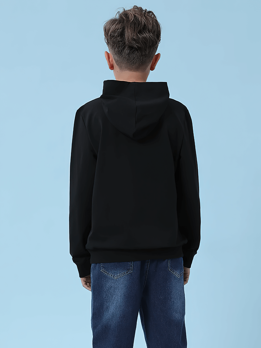 Child wearing black pullover hoodie for boys and girls, casual school outfit, back view against blue background. Versatile winter wear.