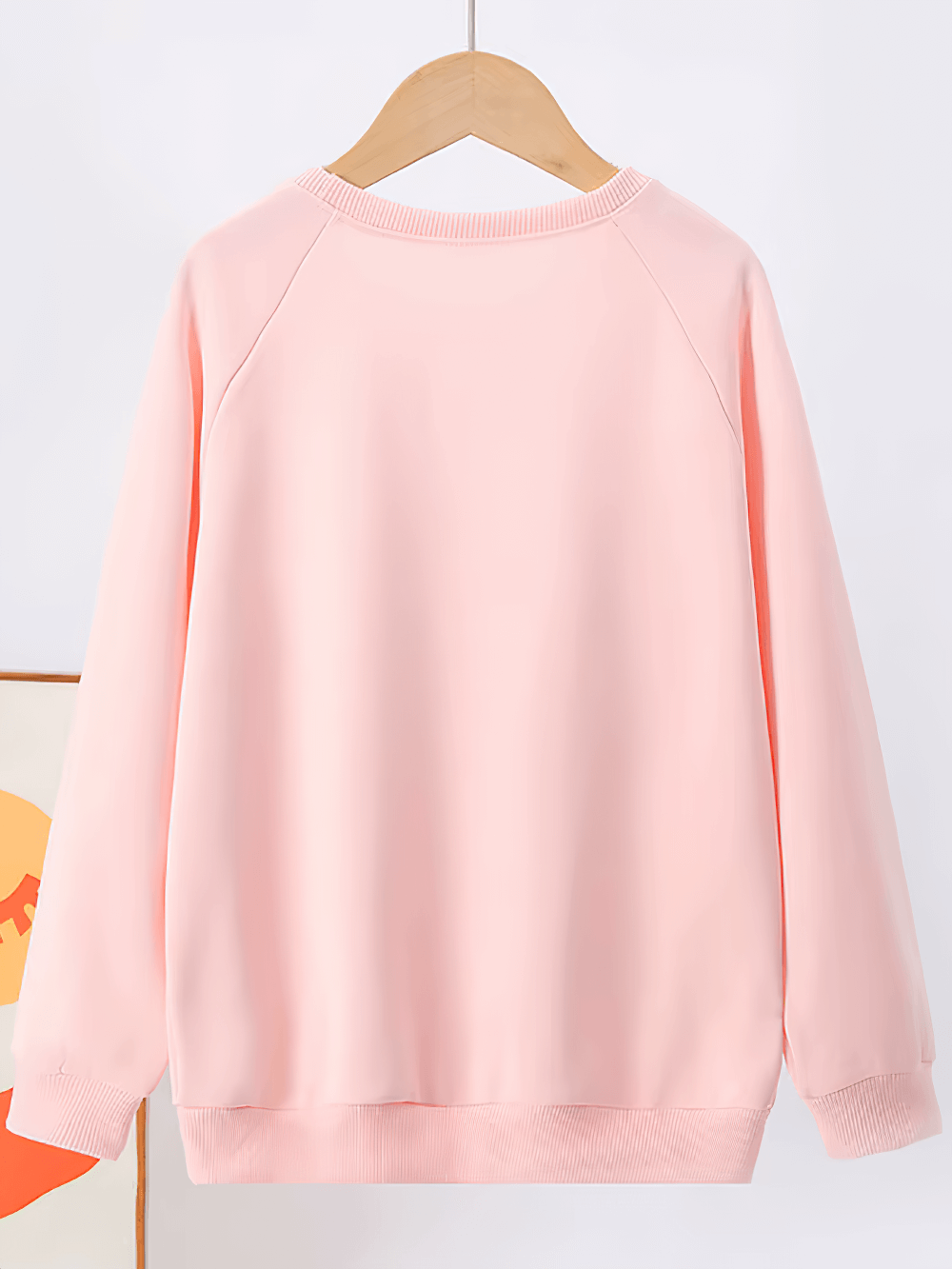 Kids solid color sweatshirt in pink, full sleeves, perfect for everyday wear and sports activities, made of soft polyester fabric for comfort.