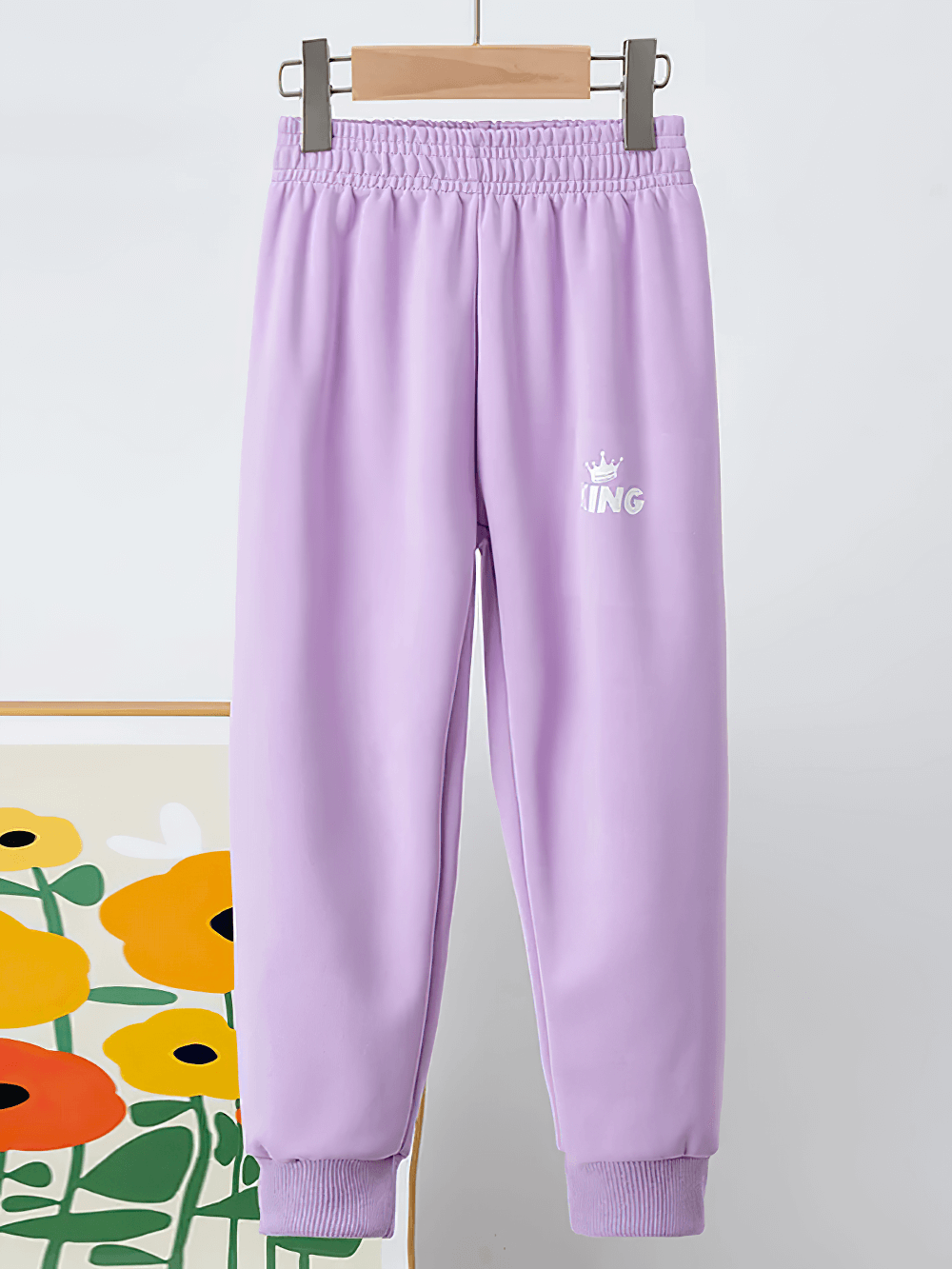 Kids Sport Jogger Sweatpants with Elastic Waist - SF3888 in purple with elastic waist and ribbed cuffs for boys and girls, hanging.