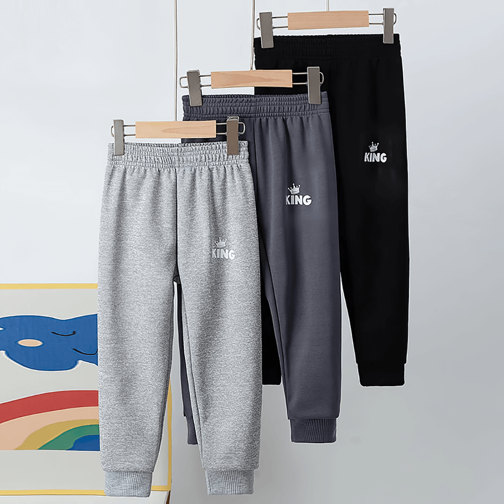 Kids Sport Jogger Sweatpants with Elastic Waist - SF3888 in various colors hanging on display