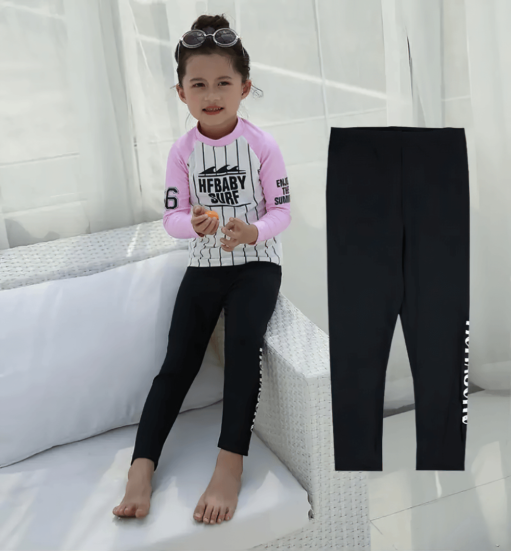 Young girl wearing Kid's Sport Long Pants with Quick Dry Fabric - SF3586, enjoying the sun-protection and quick-dry features at the pool.