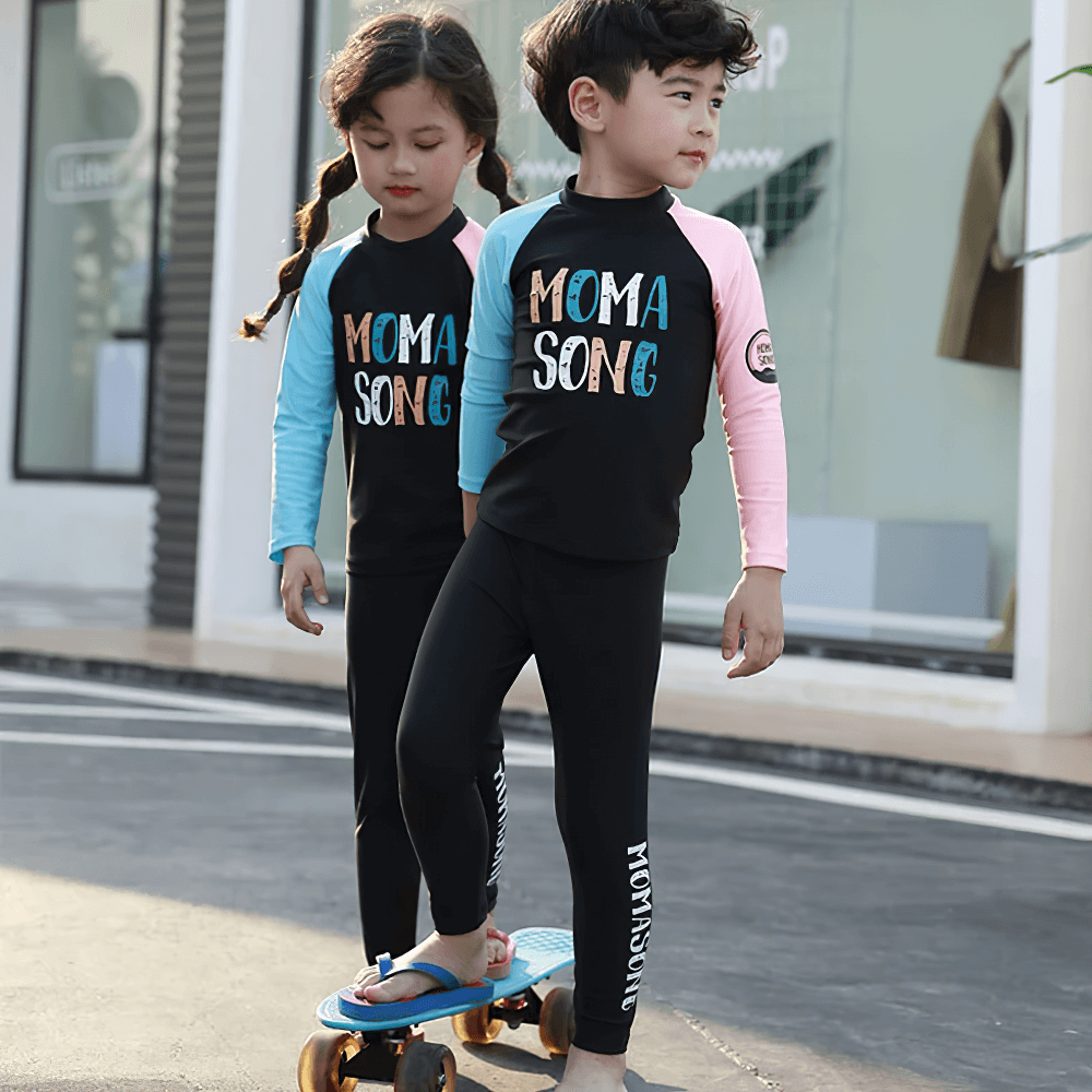 Kids wearing Kid's Sport Long Pants with Quick Dry Fabric - SF3586 for sun-protection and quick-dry comfort, perfect for active play.