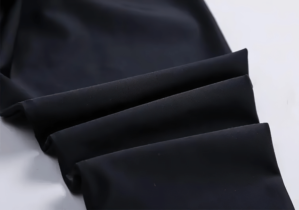 Close-up of Kid's Sport Long Pants with Quick Dry Fabric - SF3586, showcasing the smooth, durable black nylon material and elastic waist.