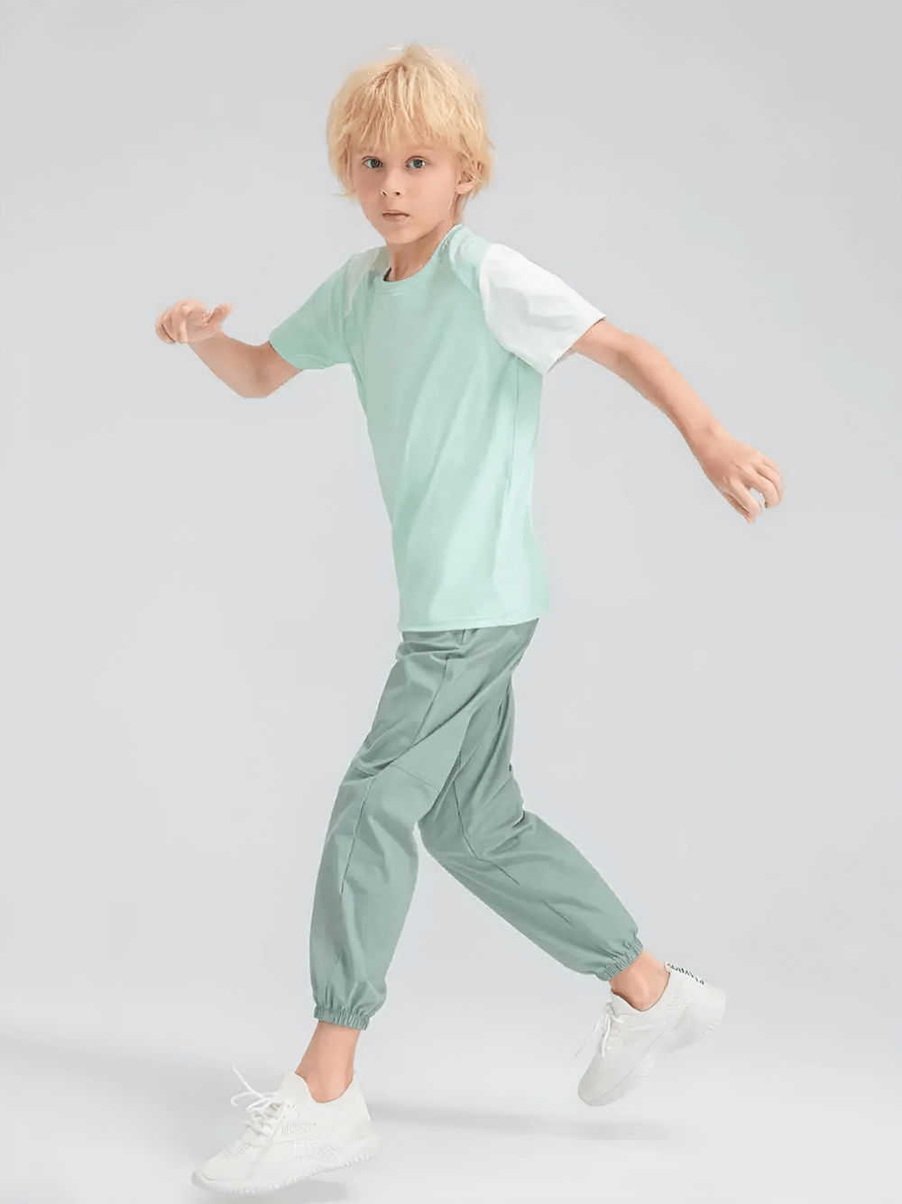 Young athlete in the Kids Sport T-Shirt with Mixed Color Raglan Sleeves - SF3856, designed for active play and training comfort.