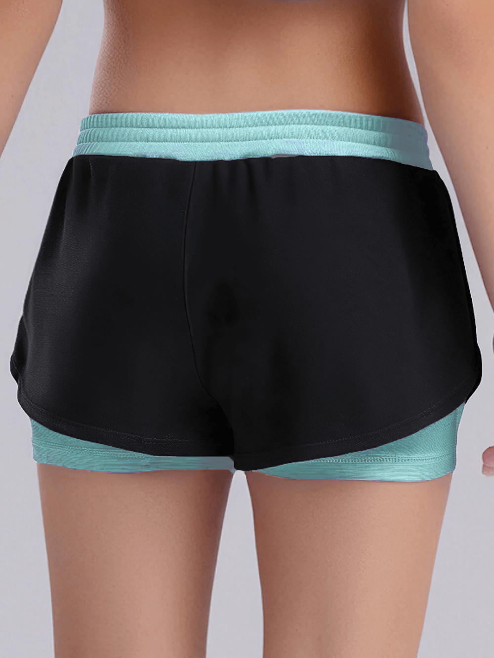 Back view of Kids Sports Yoga Shorts with Double-Layer Design - SF3783 in black and turquoise