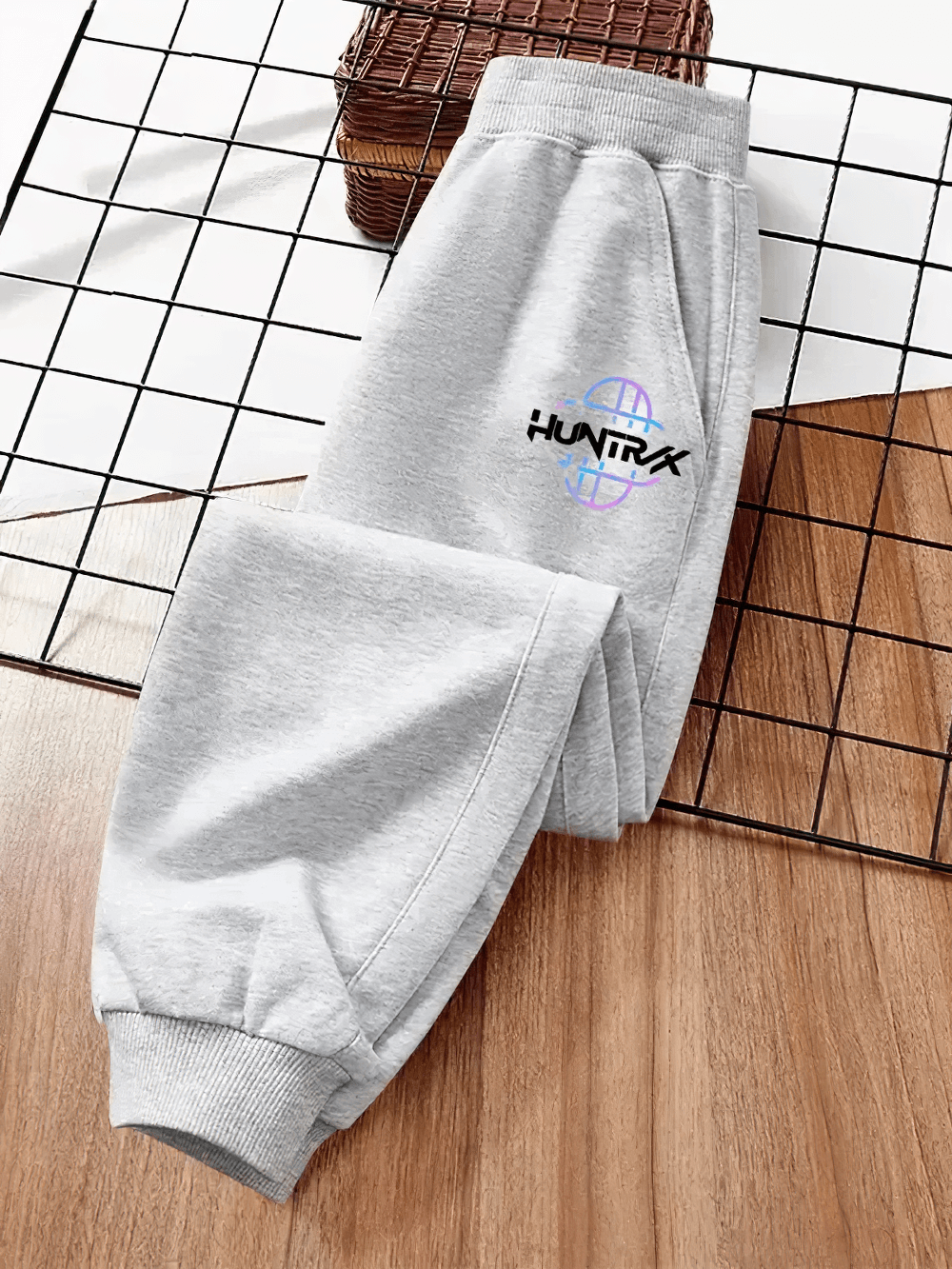 Stylish Kids Sporty Jogger Pants with Elastic Cuffs - SF3882, featuring sleek design, bold logo, and ribbed cuffs for athletic style and comfort.