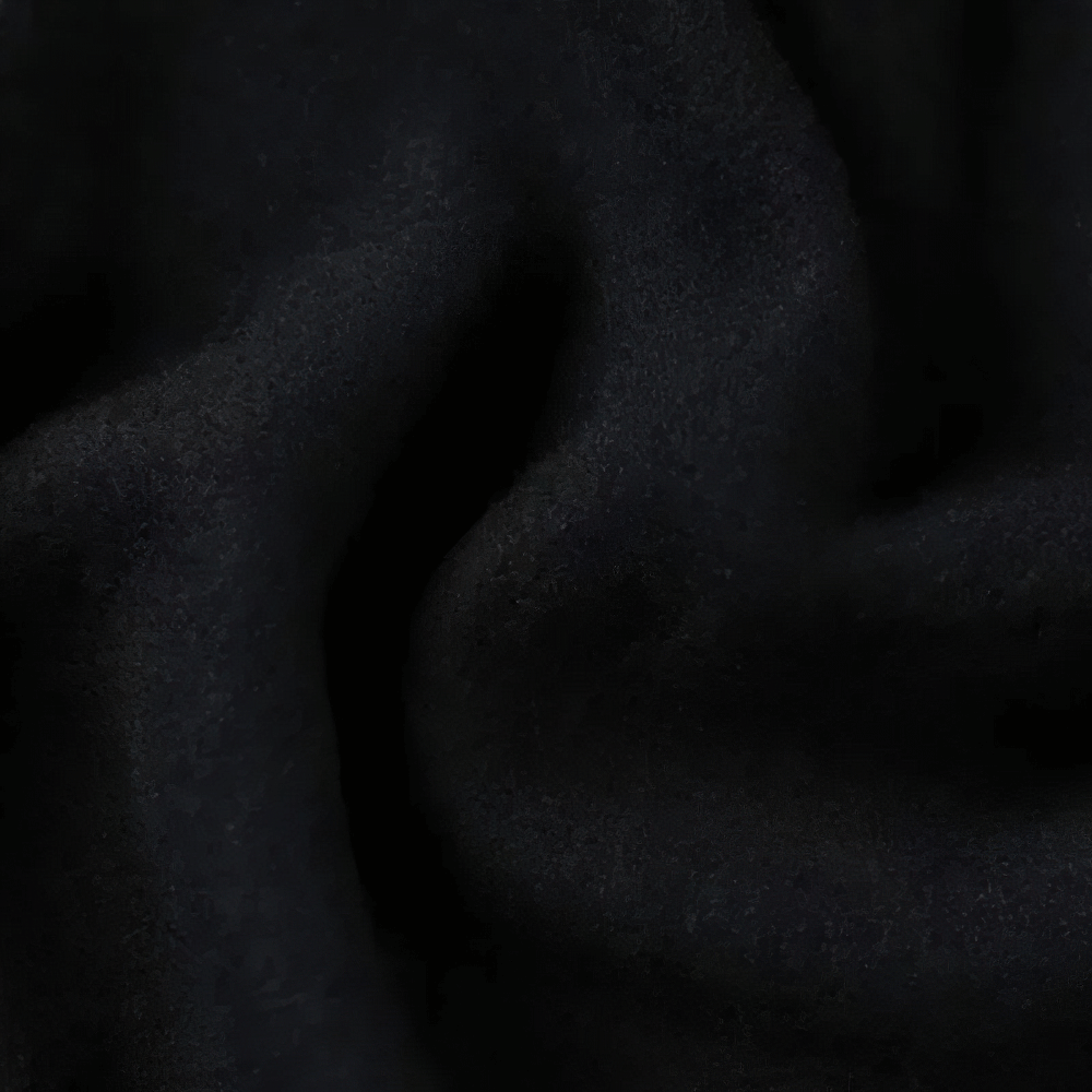 Close-up of black polyester fabric texture, showcasing soft and flexible material used in Kids Sporty Jogger Pants with Elastic Cuffs - SF3882.