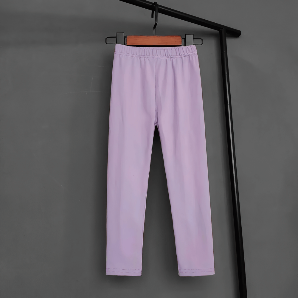 Kids Stretch Leggings in Bright Solid Colors - SF3678 hanging on a black hanger, showcasing vibrant purple color and sleek, skinny fit.