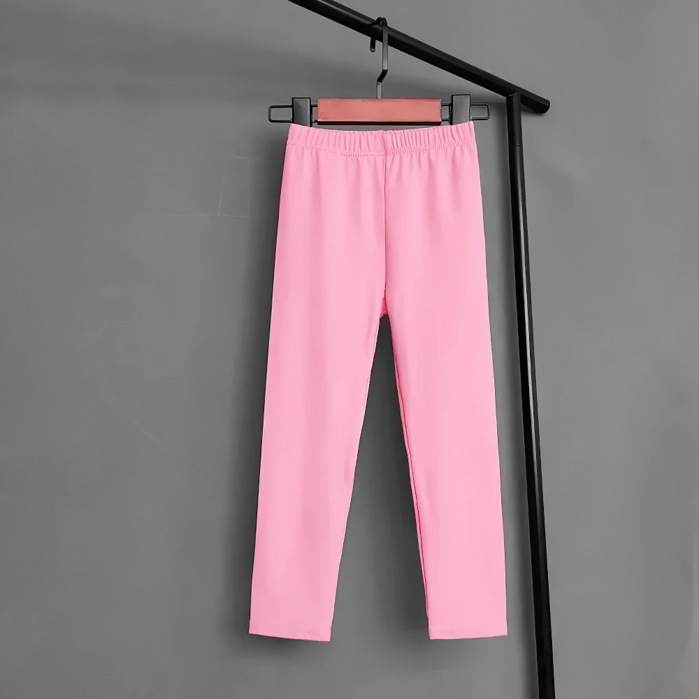 Kids Stretch Leggings in Bright Solid Colors - SF3678, pink leggings with elastic waistband hanging on a rack, flexible fabric for active kids