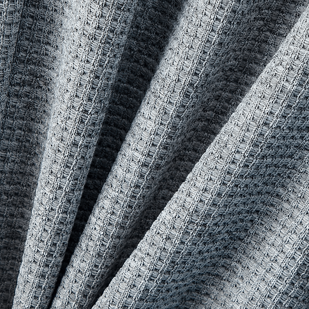 Close-up of blue waffle knit fabric texture from Kids Stylish Waffle Knit Sports Jogger Pants - SF3874.