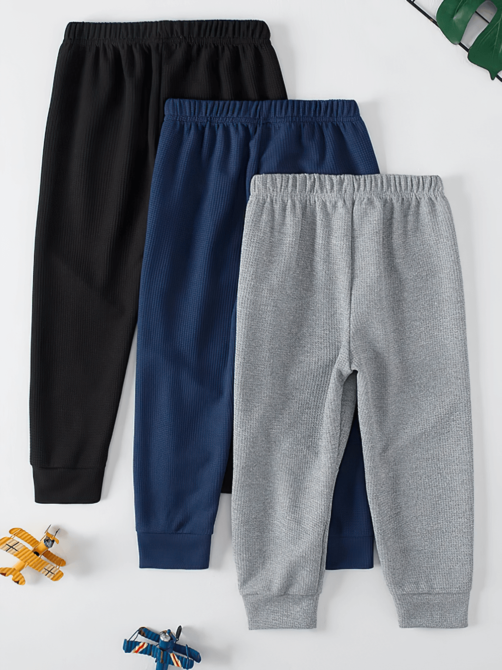 Kids Stylish Waffle Knit Sports Jogger Pants - SF3874 in black, blue, and gray colors displayed with toy planes