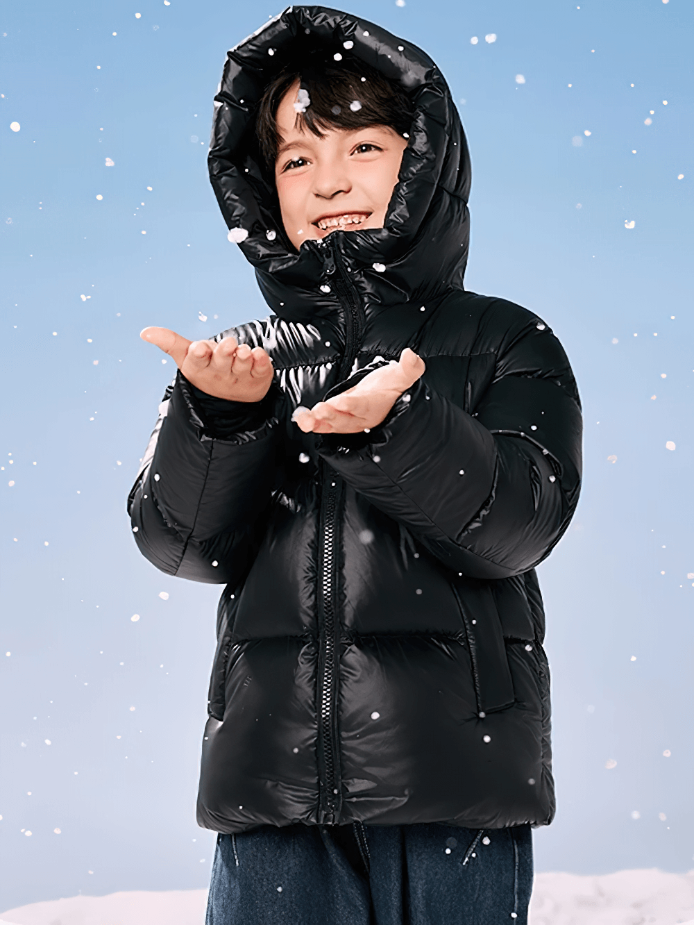 Child smiling in black Kids Thermal Down Puffer Jacket with Hood - SF3695 catching snowflakes outdoors.