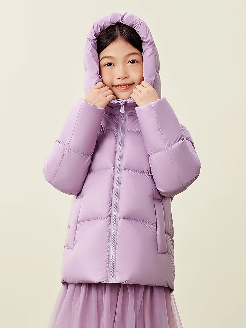 Child wearing the Kids Thermal Down Puffer Jacket with Hood - SF3695 in lavender purple, showcasing its warmth and cozy fit.