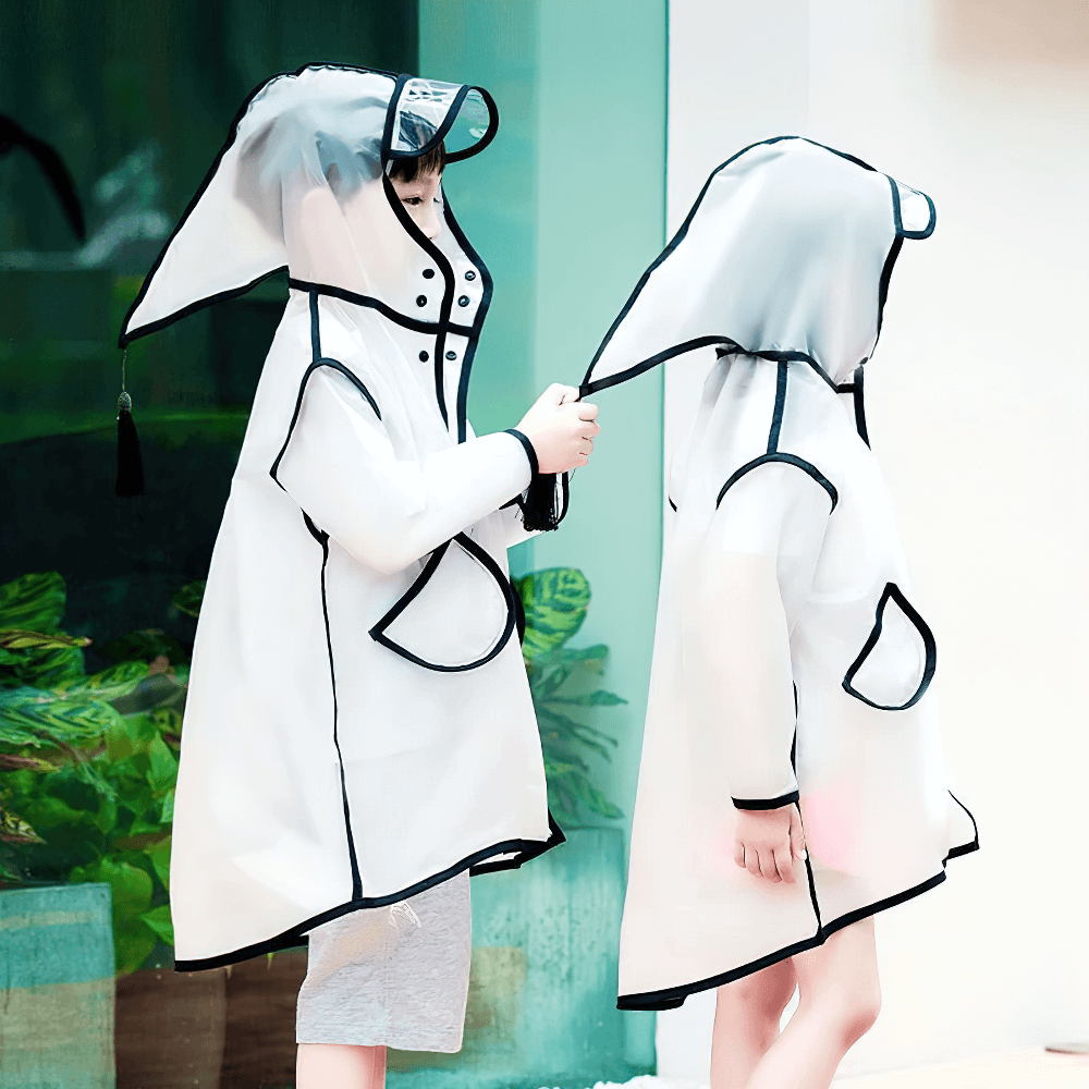 Kids wearing Kids Transparent Long Hooded Raincoat - SF3671 with playful design and cozy hood, black trim, and protective visor.