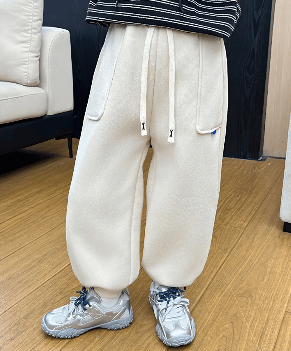 Kids Warm Fleece Pants with Elastic Waist - SF3740 in creamy white for cozy winter comfort and style on wooden floor.