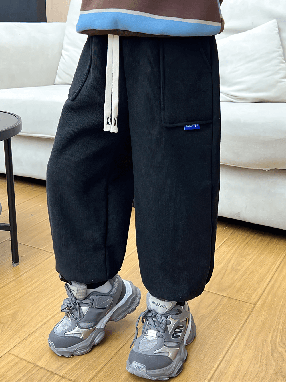 Child wearing Kids Warm Fleece Pants with Elastic Waist - SF3740, showcasing ankle-length winter comfort and sporty style.
