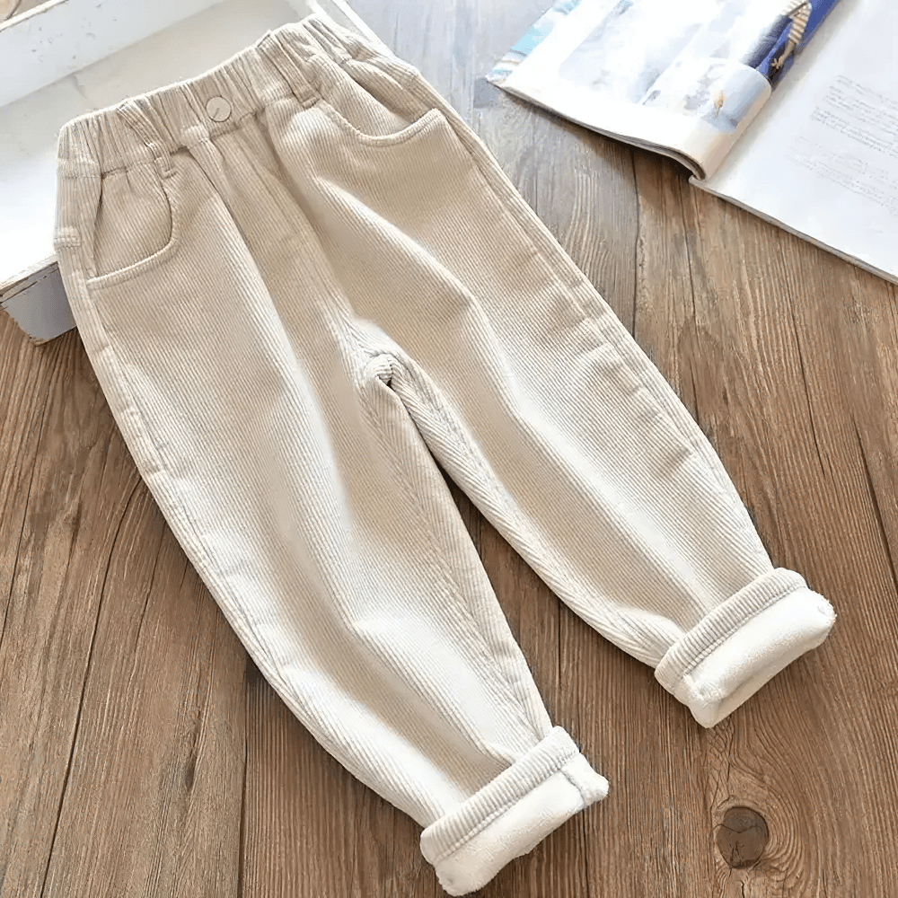 Kids Warm Pants with Elastic Waist and Fleece Lined - SF3803 on wooden floor, showcasing beige corduroy texture and handy pockets.