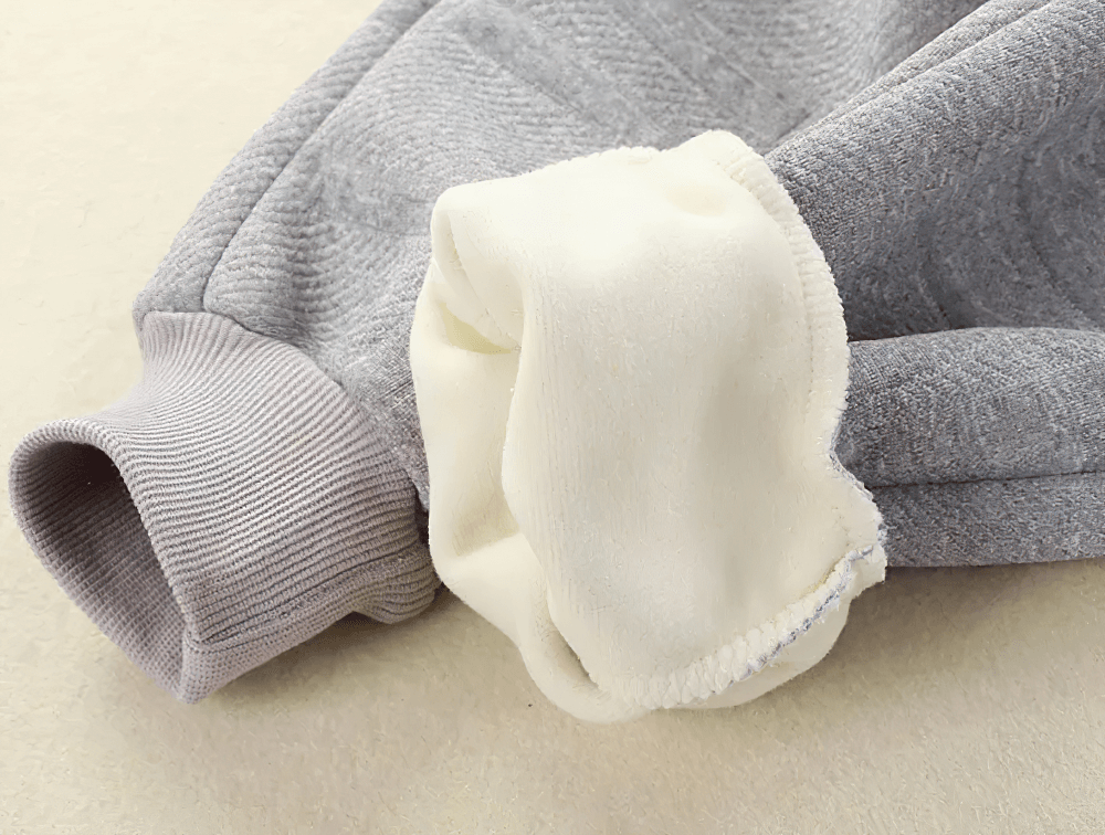 Close-up of Kids Warm Sport Jogger Pants with Elastic Waist - SF3884, displaying soft fleece lining and ribbed cuffs.