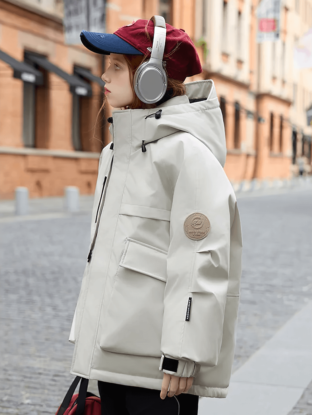 Child wearing Kids Waterproof Hooded Puffer Jacket with Pockets - SF3632 in an urban setting, showcasing its warmth and practical design.