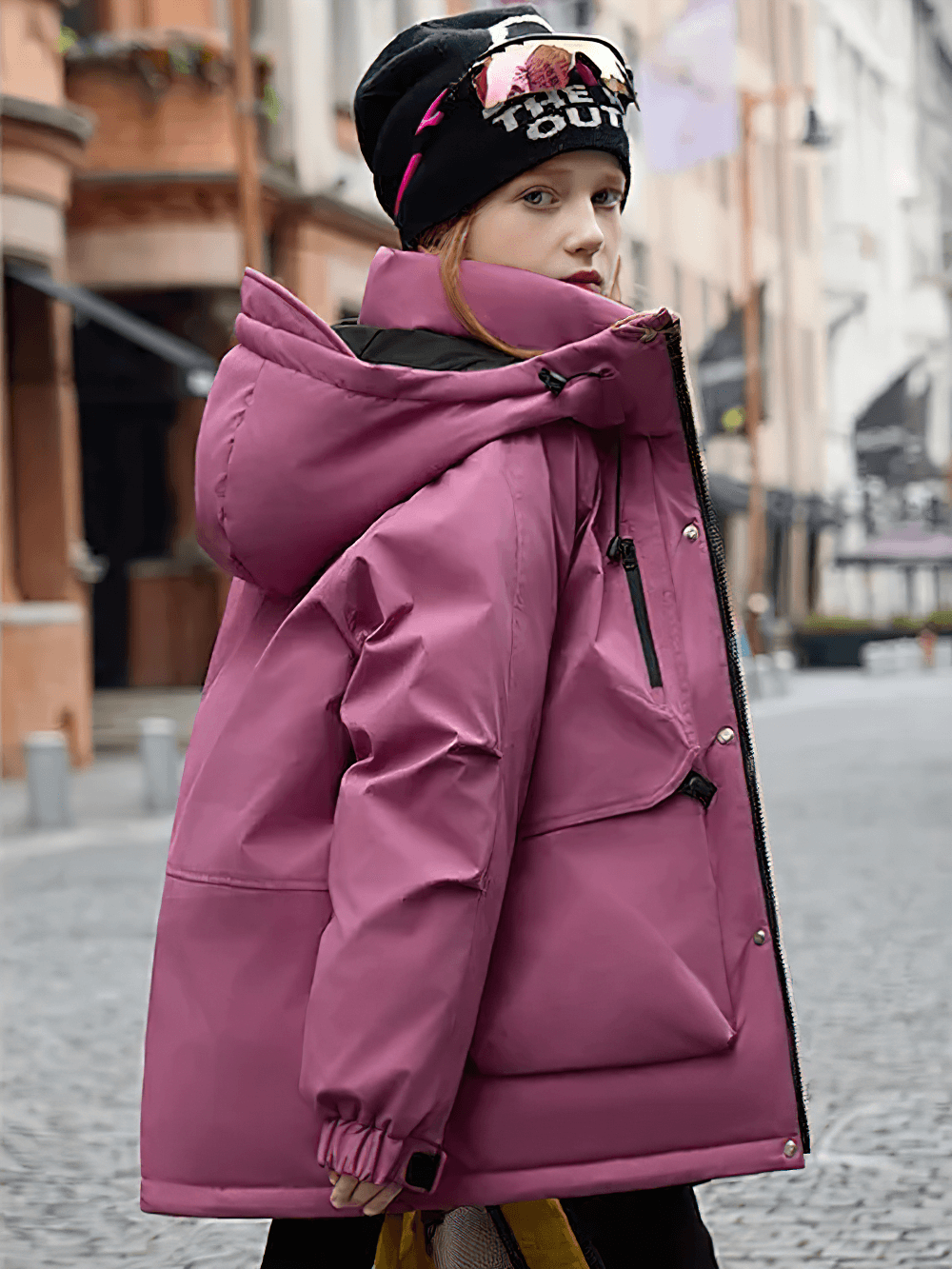 Stylish girl wearing Kids Waterproof Hooded Puffer Jacket with Pockets - SF3632, perfect for winter adventures, showing off secure pockets.