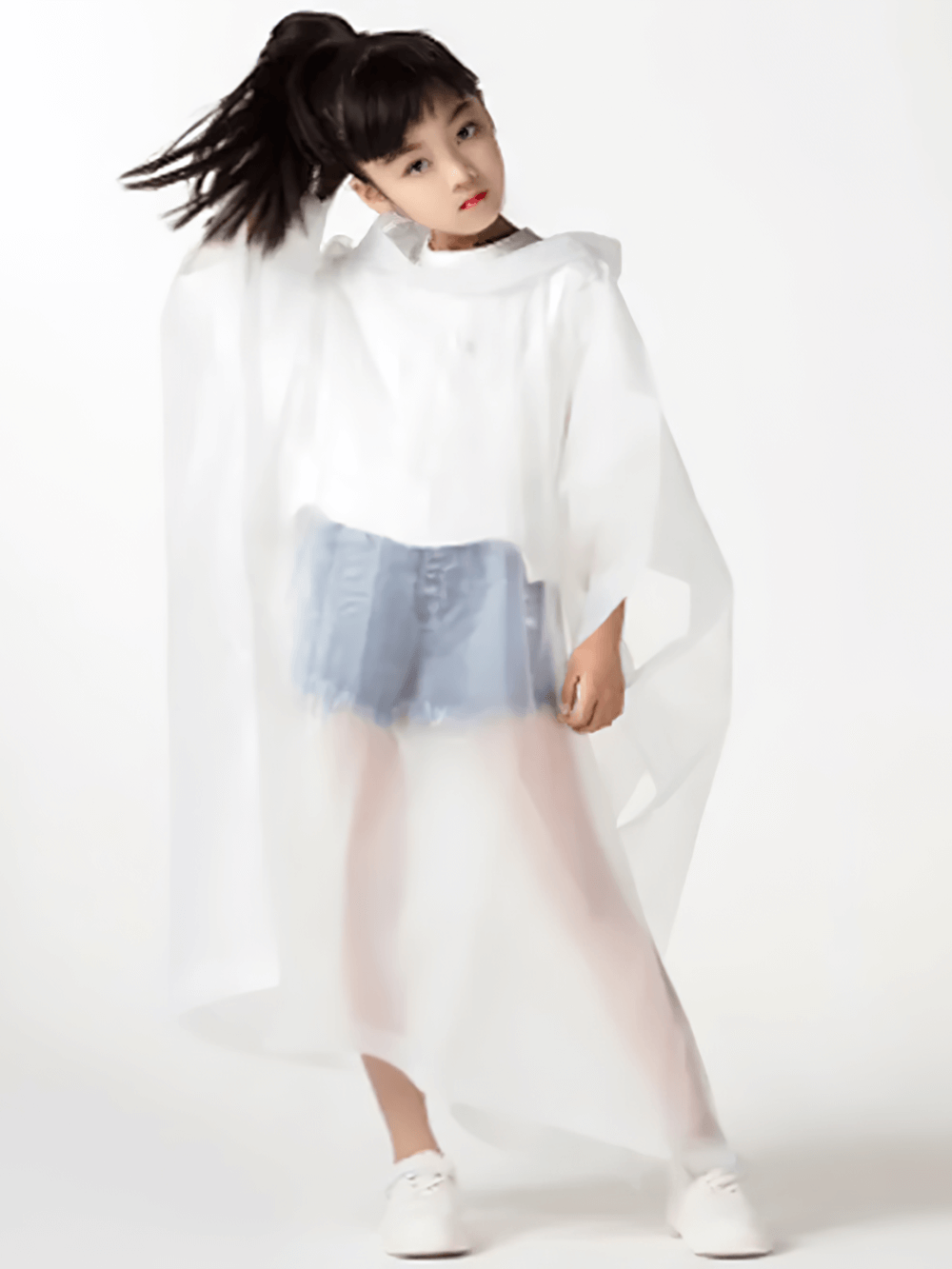 Stylish child wearing Kids Waterproof Rain Poncho with Hood - SF3656, shows lightweight foldable design and full waterproof protection.