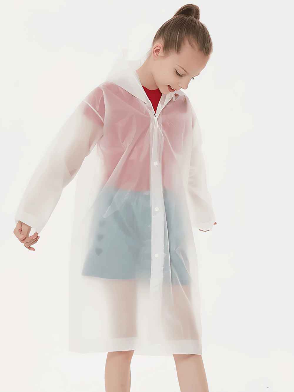 Child wearing a transparent Kids Waterproof Travel Rain Poncho With Hood - SF3646, designed for outdoor use, displaying its lightweight and durable features.