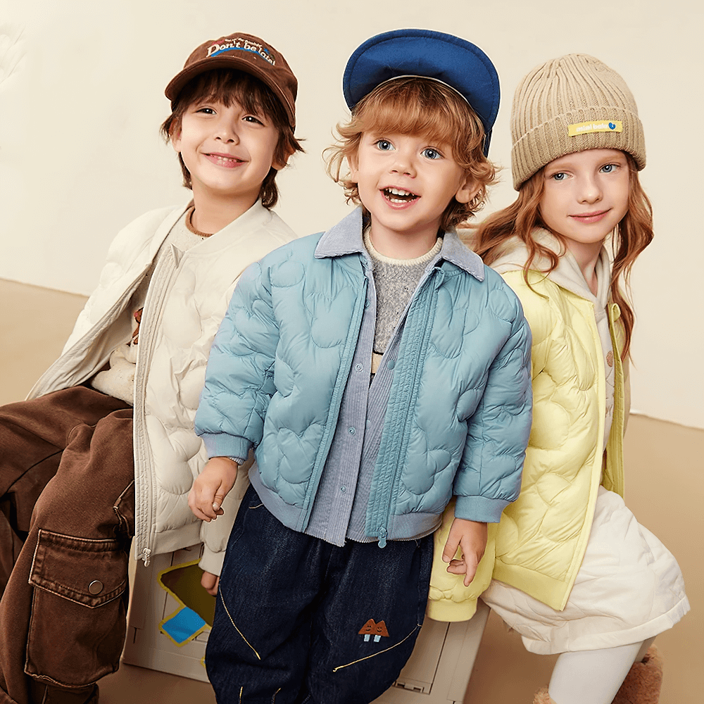 Three kids wearing the Kids Windproof Down Jacket with Cloud Design - SF3703, showcasing stylish outdoor protection.