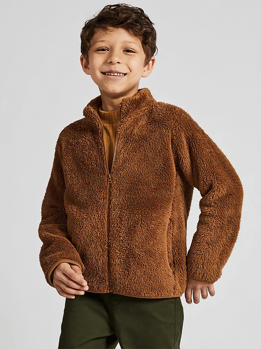 Smiling child wearing a cozy brown Kid's Zip-Up Polar Fleece Jackets That Keep Warm - SF3548, perfect for chilly days.