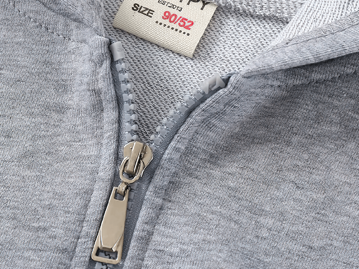 Close-up view of Kids Zipper Soft Hoodie with Striped Sleeves - SF3768, focusing on the durable zipper and fabric texture in grey.