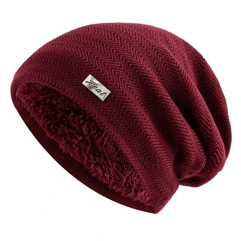 Warm knit beanie with fur lining for men and women, featuring a trendy slouchy fit and classic style in deep burgundy color.