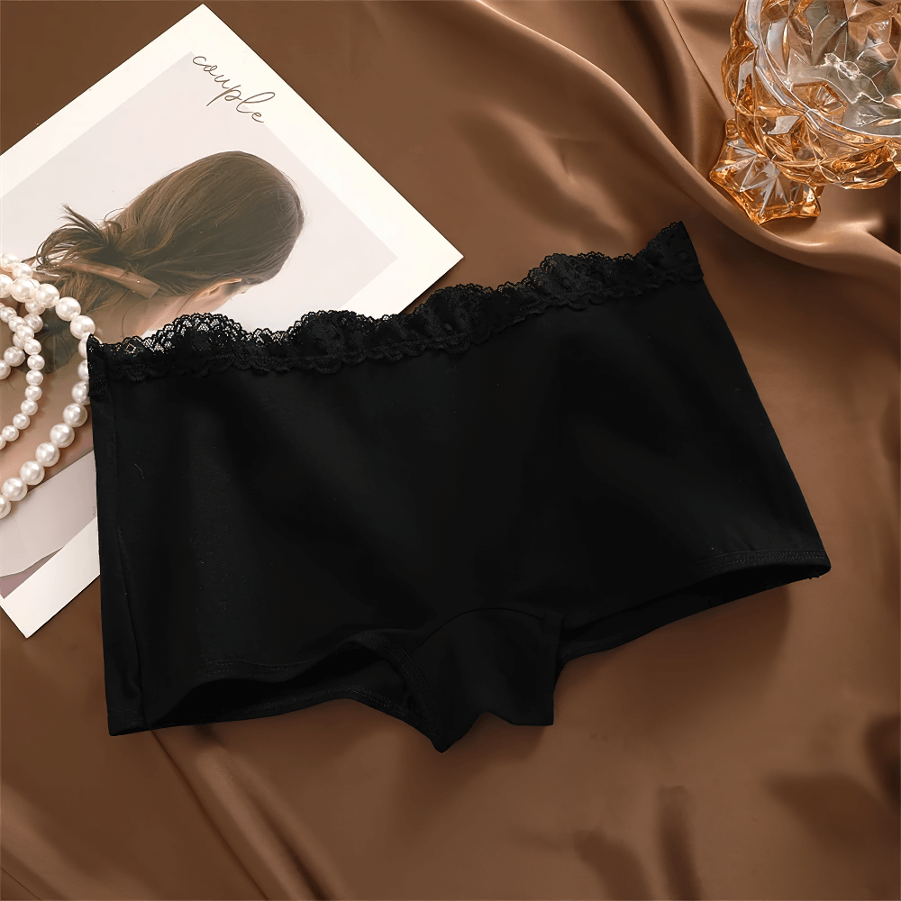 Elegant lace trim black boyshort panties on a satin backdrop, showcasing soft and stretchy cotton blend fabric for everyday wear.