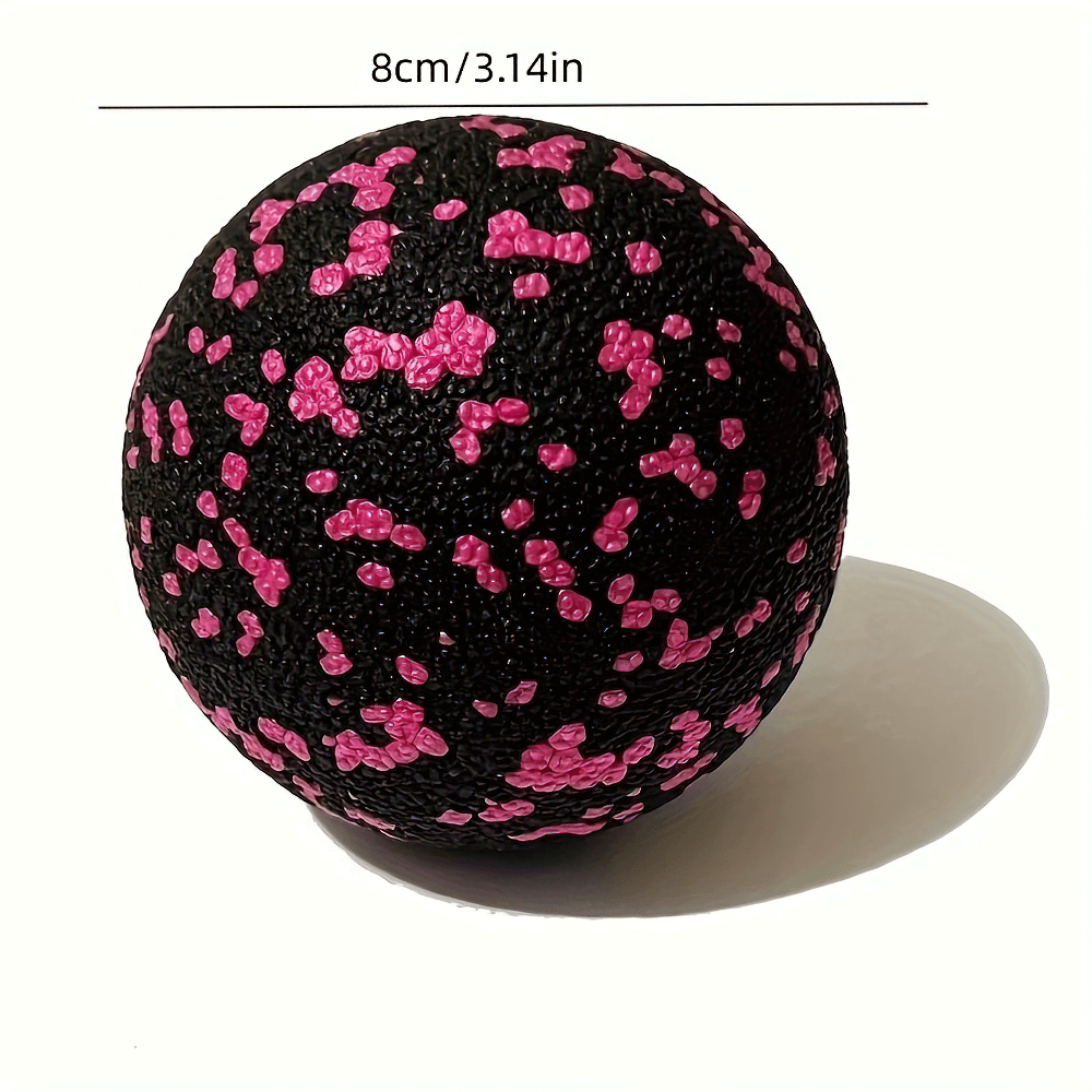 Black and pink lacrosse massage ball for myofascial release and deep tissue therapy, 8cm diameter, perfect for yoga and muscle recovery.