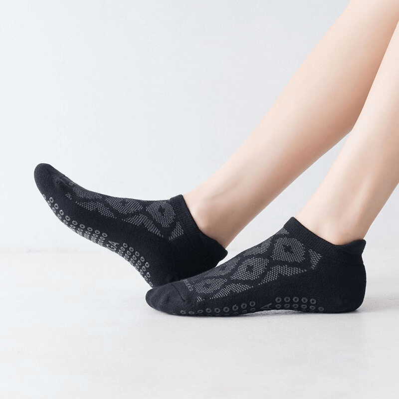 Black breathable anti-slip cotton Pilates socks for women, featuring stylish design and comfort for workouts and casual wear.