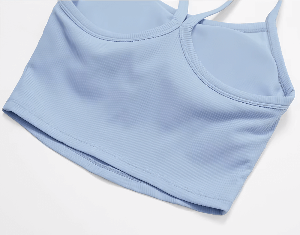 Ladies light blue ribbed racerback sports tank top. Breathable, quick-dry fabric ideal for yoga and workouts. Stylish and supportive.