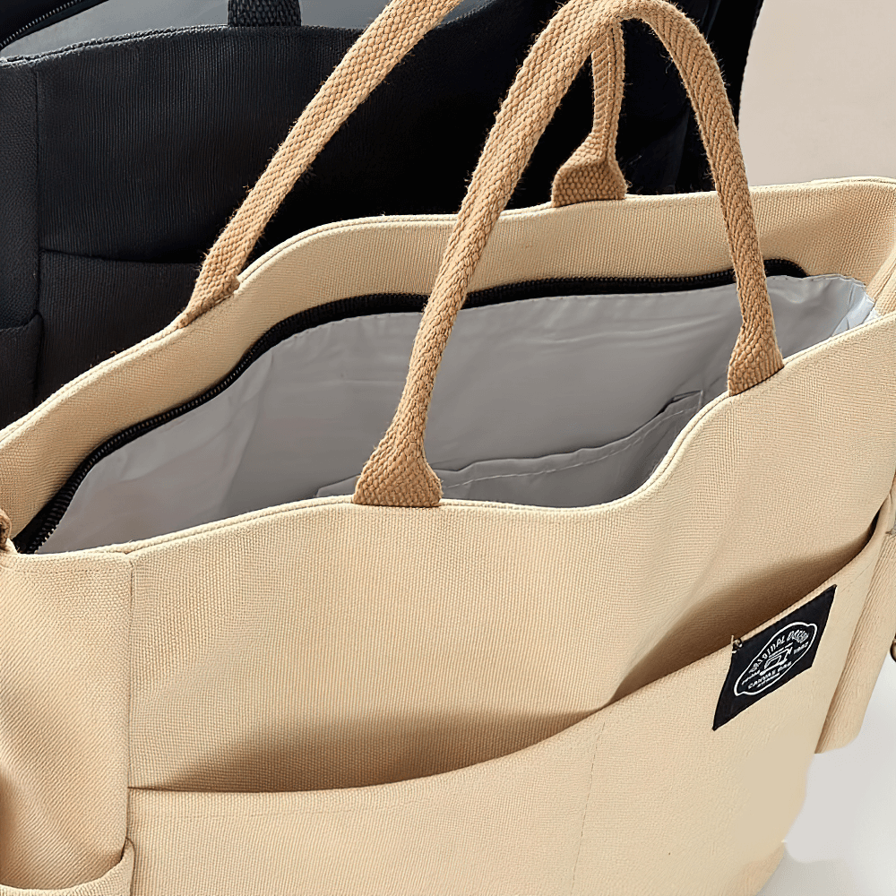 Beige large canvas tote bag SF2663 with multi-pocket design and adjustable strap for shoulder or crossbody wear.