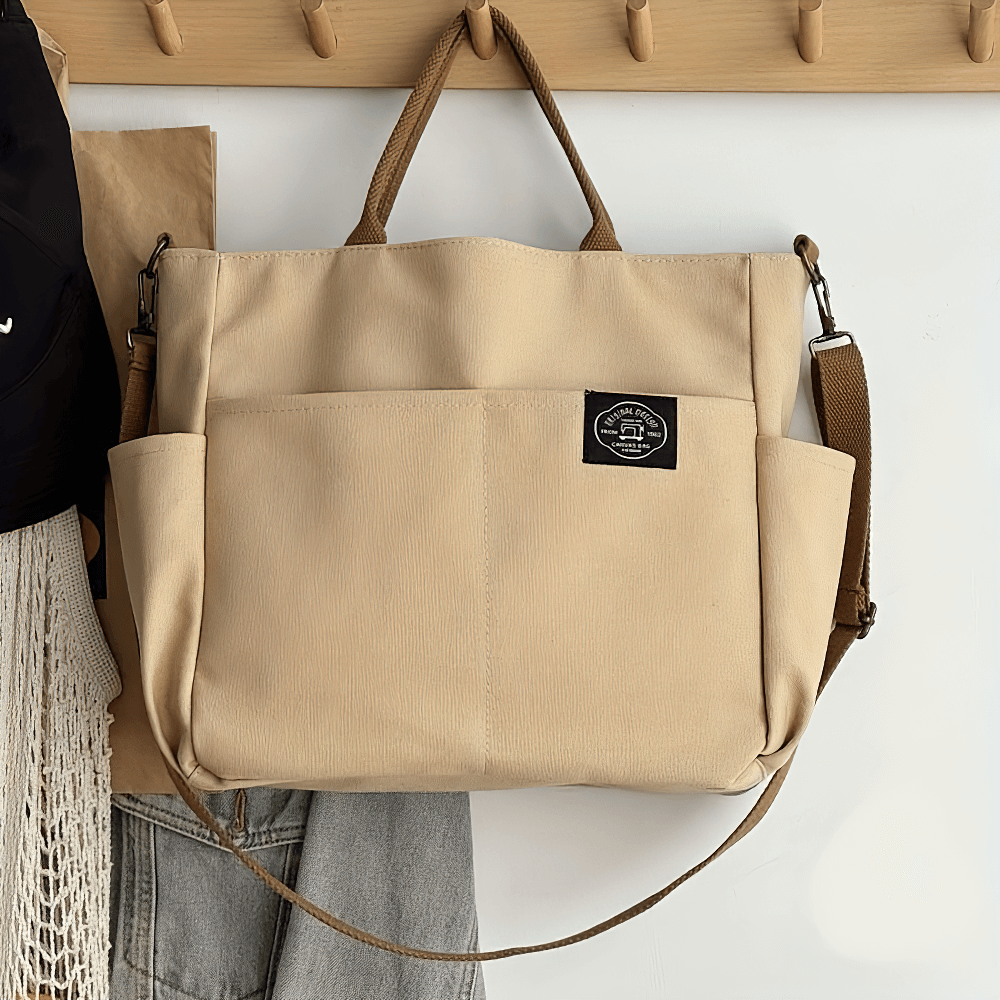 Beige large canvas tote bag SF2663 with multi-pocket design and adjustable strap, perfect for shoulder or crossbody wear.