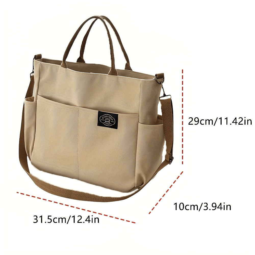 Large canvas tote bag SF2663 with multi-pocket design and adjustable strap for crossbody or shoulder wear.